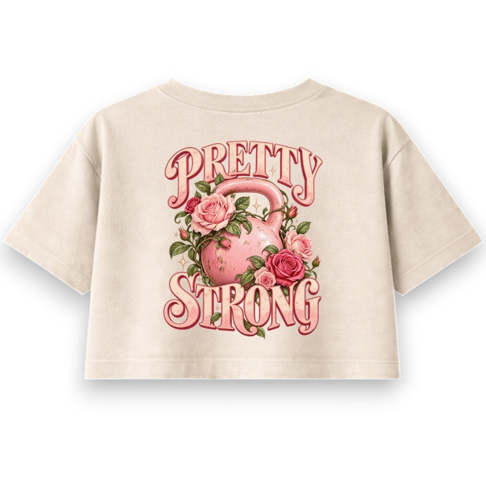 Pretty Strong Oversize Crop Top Sand mit rosa Kettlebell und Rosen Backprint